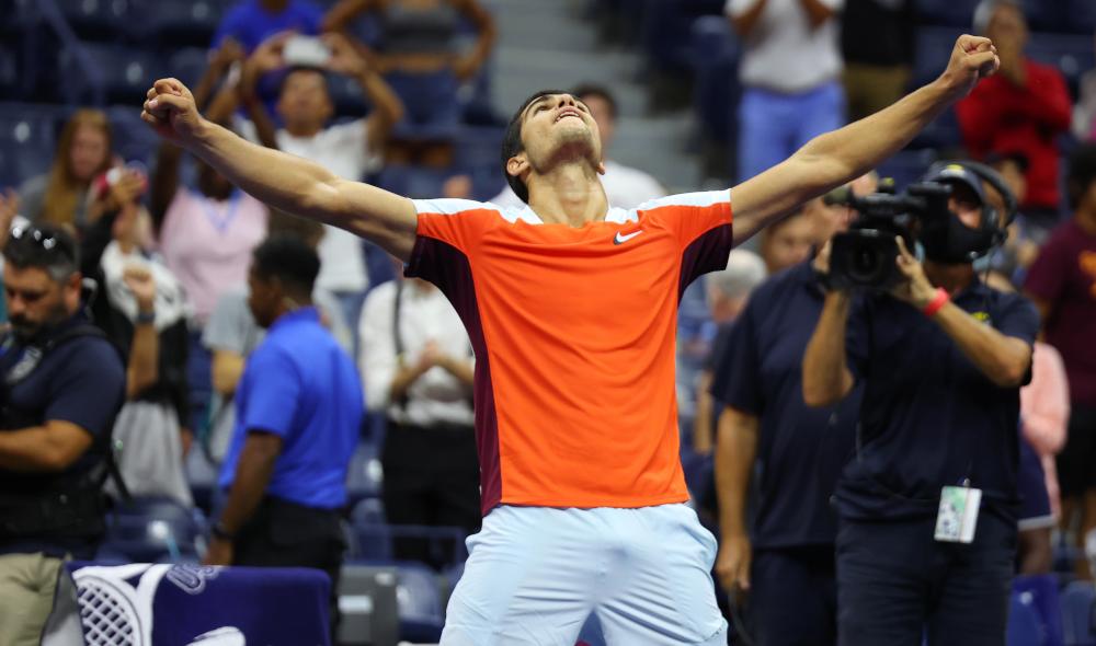 Alcaraz saves match point to join Tiafoe in US Open semis